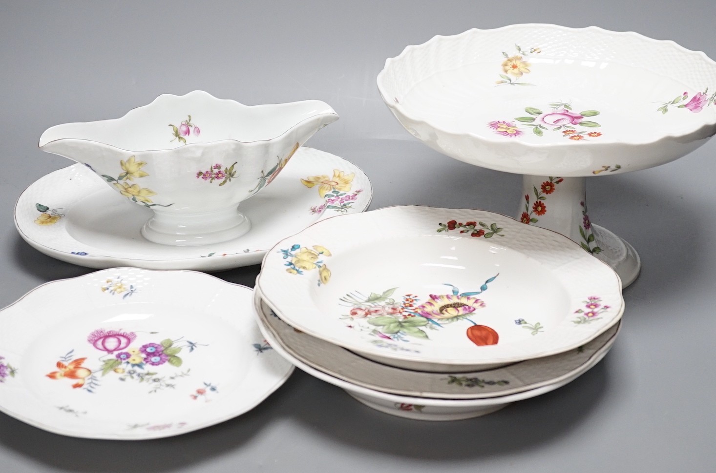 Four Herend porcelain dishes, a comport and sauce boat with integral stand, late 19th/early 20th century